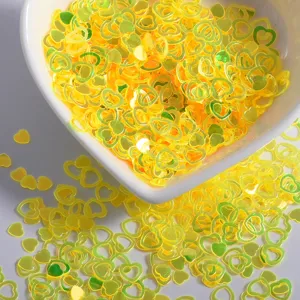 Yellow heart nail sequins glitter holographic loose flakes for DIY crafts and manicure art.