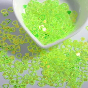 Neon green hollow heart nail sequins glitter for DIY nail art and handmade craft decoration.