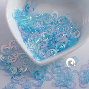 Paillettes per unghie con lune e stelle iridescenti blu per bricolage e trucco.