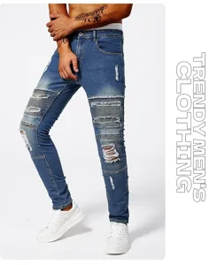 Close-up detail of mens distressed slim fit blue jeans with pleated knee and ripped design.