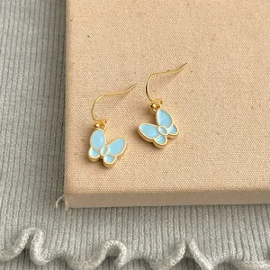 Elegant light blue enamel butterfly earrings with gold hook design for women and girls daily.