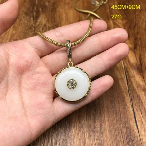 Vintage retro brass snake chain necklace with white jade safety buckle pendant and rhinestones.