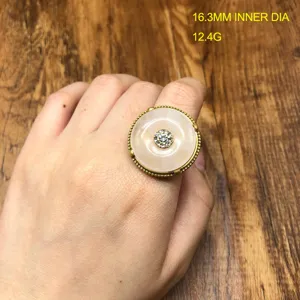Vintage style peace buckle ring with rhinestones and metal band for women jewelry fashion.