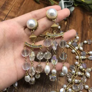 Vintage crystal pearl tassel earrings detail, elegant retro gold jewelry set for women fashion.