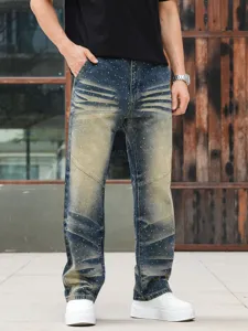 Detailed view of men's rhinestone washed straight fit denim jeans in vintage blue finish.