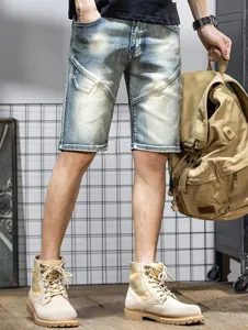 Men's denim shorts detail shot, casual patchwork slim fit five-point trousers for summer.