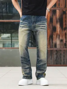 Men's loose straight fit distressed jeans featuring heavy wash and rhinestone details.