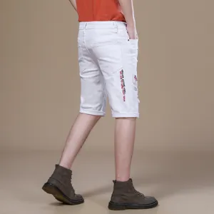 Men's summer white denim shorts, slim fit casual five-point cuffed pants with cool embroidery.