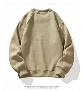 Detail view of the men's casual waffle knit crewneck sweatshirt in khaki. Close-up of texture.