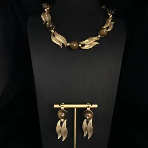Vintage style gold-tone leaf necklace and earrings set with brown beads and rhinestones.