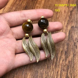 Vintage retro style metal leaf dangle earrings detail shot, showing exquisite texture and size.