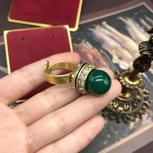 Vintage retro style green stone brass ring with dazzling rhinestones exquisite detail view.