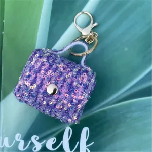 Stylish purple sequined mini bag keychain with elegant golden lobster clasp charm