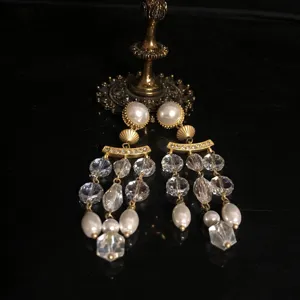Vintage antique style crystal glass pearl tassel dangle earrings, detailed closeup view.