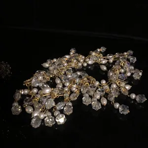 Detailed view of vintage crystal pearl fringe necklace, sparkling faceted beads.