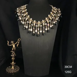 Vintage crystal glass pearl tassel necklace detail view, elegant antique fashion jewelry.
