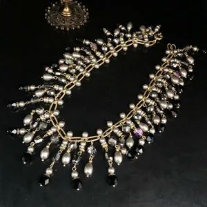 Vintage style crystal glass pearl tassel necklace, elegant retro statement jewelry.