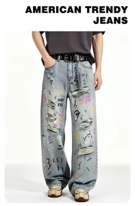 Men's loose straight fit light blue washed denim jeans with colorful graffiti and distressed rips.