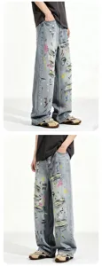 Trendy light wash distressed denim jeans with colorful graffiti prints, loose straight fit.