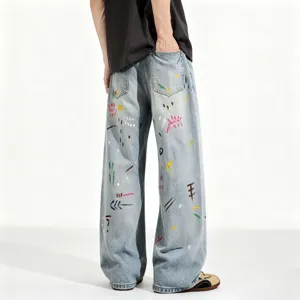 Men's loose fit straight leg light blue washed denim jeans with stylish colorful graffiti print.