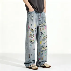 Men's loose straight leg blue washed denim jeans with colorful graffiti art prints style.