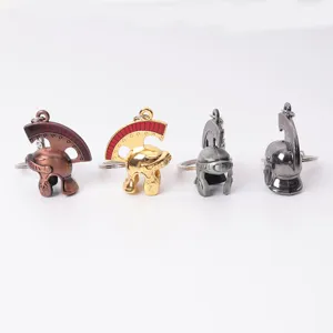 Close-up detail shot of vintage metal roman soldier helmet keychains in various colors.