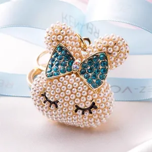 Pearl bunny rabbit keychain with blue crystal bow charm, cute handbag pendant accessory.