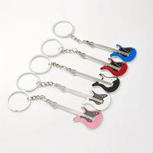 Detailed close-up view of colorful metal electric guitar keychains, stylish music bag pendant.