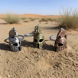 Detailed view of vintage metal soldier helmet keychains in desert outdoor scene setup.