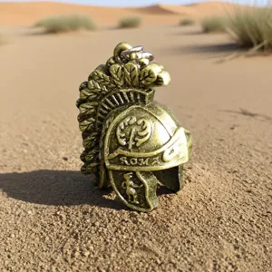Vintage bronze Roman soldier helmet metal keychain pendant, detailed retro accessory.