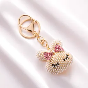 Pearl bunny head keychain detail view with sparkling pink crystal bow and gold ring