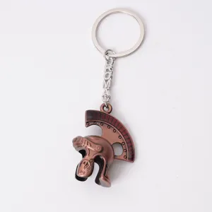 Retro Roman soldier helmet metal keychain pendant detail, vintage bronze alloy custom design souvenir.