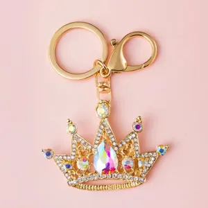 Detailed view of a golden crown rhinestone keychain with colorful crystal charm and lobster clasp.