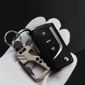 Detail shot of multifunctional metal car keychain and key shell pendant in elegant close-up.
