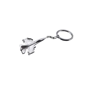 Close-up view of the exquisite metal fighter jet pendant on a sturdy key ring detail.