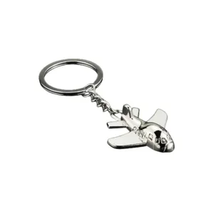 Close-up detail of the creative airplane metal keychain, polished silver finish and ring.