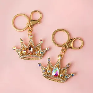 Rhinestone crown keychain detailed view, sparkling crystal bag charm and car key ring accessory.