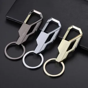 Metal car keychain set detail shot, stylish geometric carabiner and keyring for men and women.