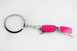 Creative metal keychain with pink miniature glasses pendant, cute detail view for bags and keys.
