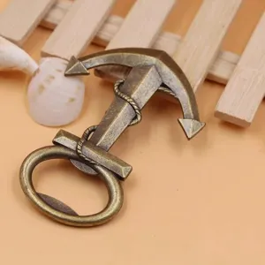Vintage metal anchor bottle opener detail shot, perfect wedding return gift and party favor.