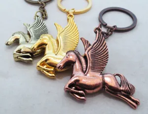 Detailed view of creative metal pegasus keychains in antique silver, gold, and bronze finishes.