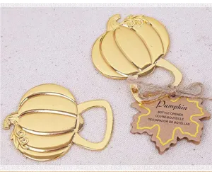 Gold pumpkin bottle opener detail shot, metal wedding return gift favor with rustic tag decor.