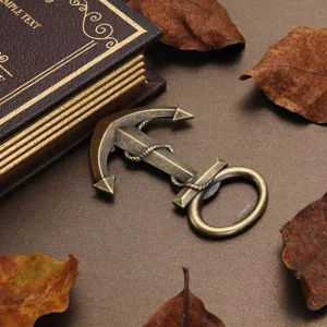 Close-up detail of a vintage bronze anchor bottle opener, showcasing fine metallic craftsmanship.