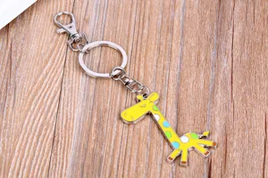 Cute cartoon giraffe keychain made of zinc alloy with metal ring for keys and bags.