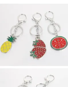 Metal fruit keychain set featuring pineapple, glitter strawberry, and watermelon designs.
