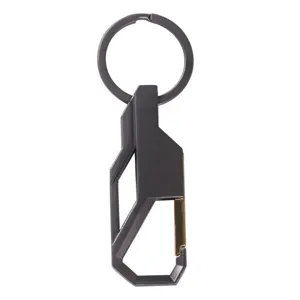 Detailed close-up of a sleek gunmetal grey car shaped metal keychain and carabiner clip.