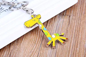 Exquisite giraffe alloy keychain detail shot, showing colorful enamel and metal ring.