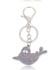 Creative metal seal keychain, cute marine animal key ring pendant for bags and car keys.