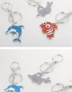 Cute metal marine animal keychains featuring dolphin, seal and fish pendants for bags.