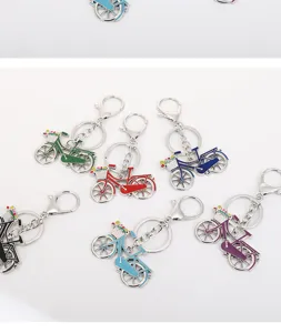 Close-up detail of colorful metal bicycle keychains, zinc alloy material, pendant accessory.